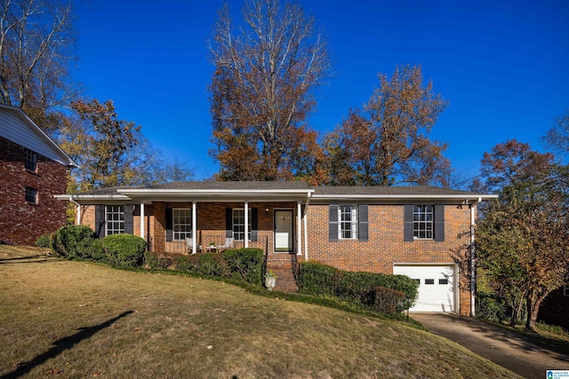 view of front facade with a porch, a garage, and a front yard