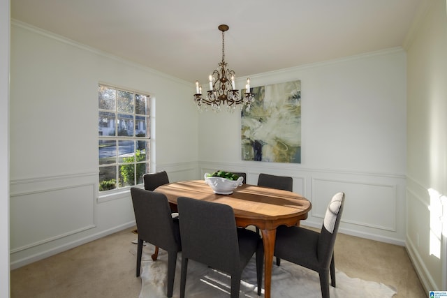 carpeted dining area featuring an inviting chandelier and crown molding