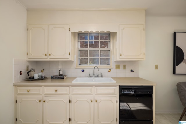 kitchen with dishwasher, tile patterned floors, crown molding, sink, and tasteful backsplash