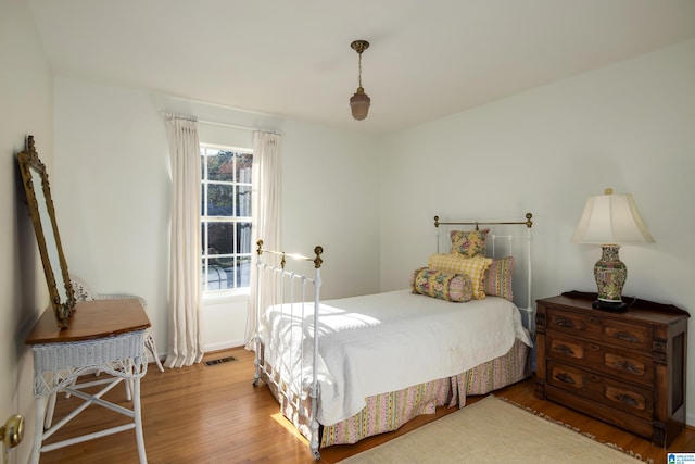 bedroom with hardwood / wood-style floors