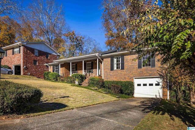 view of front of house with a front lawn, a porch, and a garage