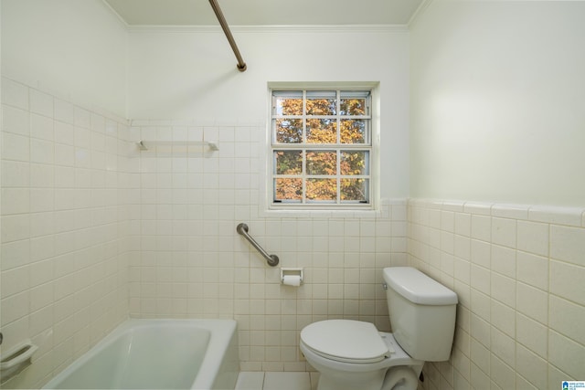 bathroom with ornamental molding, toilet, tile walls, and a tub