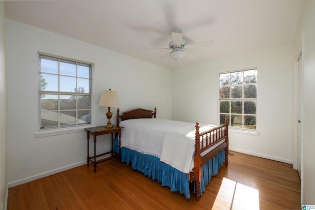 bedroom featuring hardwood / wood-style flooring and ceiling fan