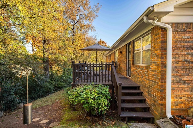 view of property exterior featuring a deck