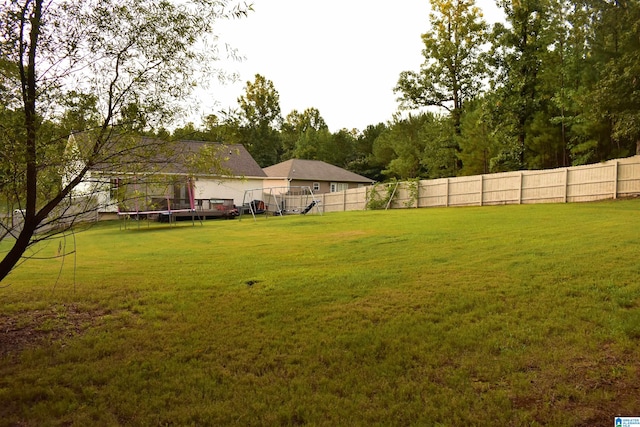 view of yard featuring a trampoline