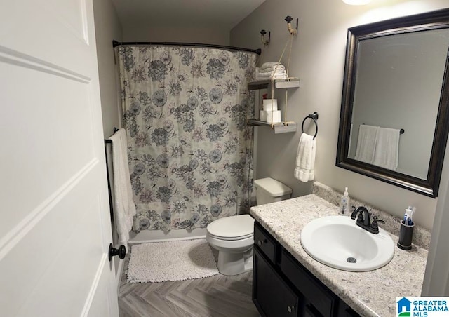 full bathroom featuring shower / tub combo, vanity, toilet, and parquet floors