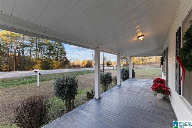 wooden terrace featuring covered porch