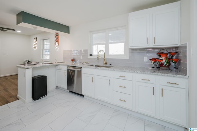 7321 Naples Ave, Birmingham, AL 35206 - kitchen featuring stainless steel dishwasher, a sink, light stone countertops, and white cabinets