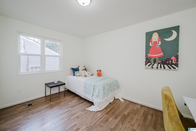7321 Naples Ave, Birmingham, AL 35206 - bedroom featuring wood finished floors and baseboards