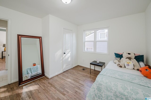 bedroom with light wood-type flooring