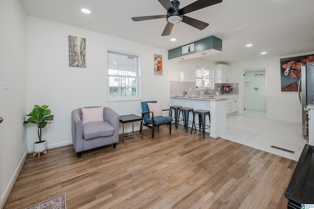 7321 Naples Ave, Birmingham, AL 35206 - living area featuring light wood-style floors, a ceiling fan, recessed lighting, and baseboards