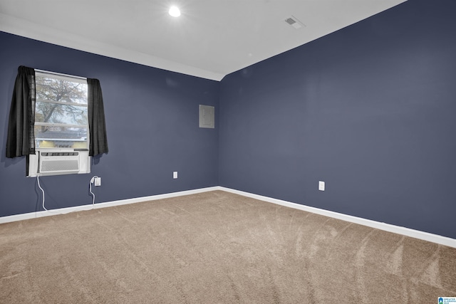 carpeted spare room featuring cooling unit