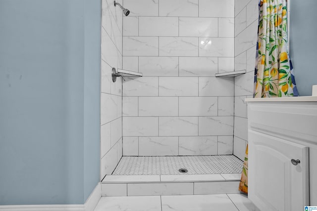 bathroom with a tile shower