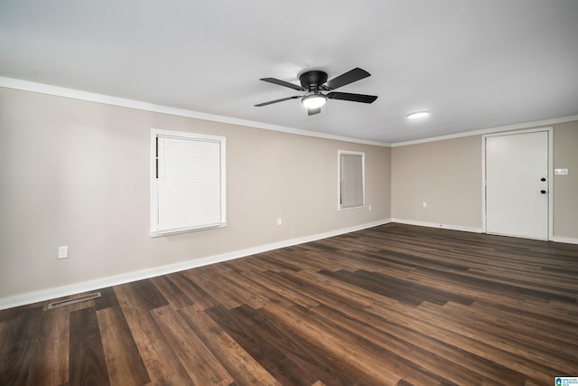 unfurnished room featuring ceiling fan, dark hardwood / wood-style flooring, and crown molding