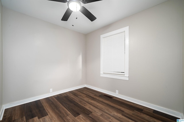 unfurnished room with ceiling fan and dark wood-type flooring