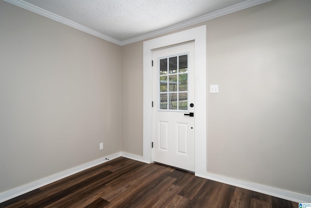 doorway featuring dark hardwood / wood-style floors, crown molding, and a textured ceiling