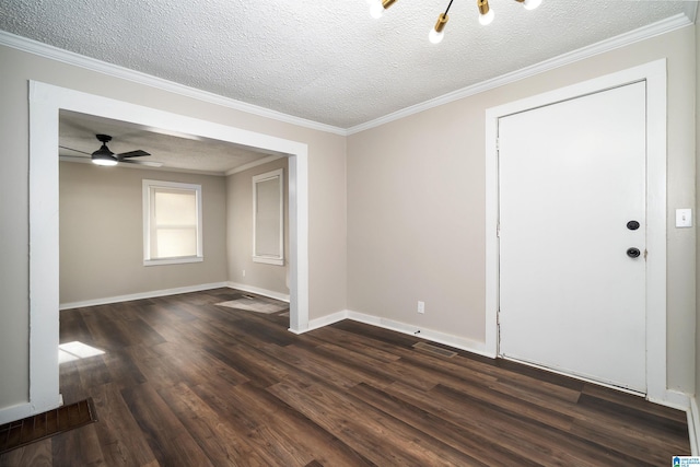 unfurnished room with a textured ceiling, dark hardwood / wood-style floors, ceiling fan, and crown molding