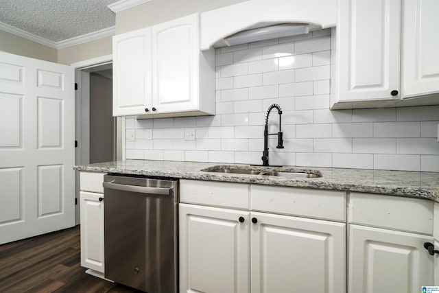 kitchen featuring stainless steel dishwasher, dark hardwood / wood-style floors, white cabinets, and sink