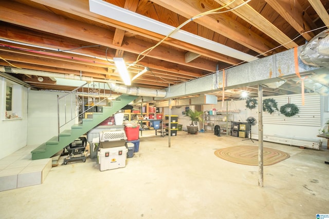 basement featuring a baseboard heating unit