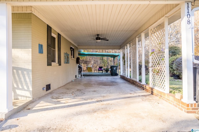 view of patio / terrace with a carport and ceiling fan