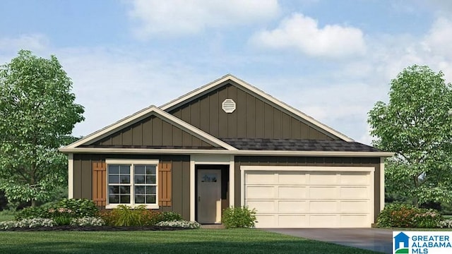 view of front of home with a front yard and a garage