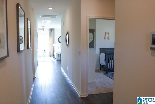 hall featuring dark wood-type flooring