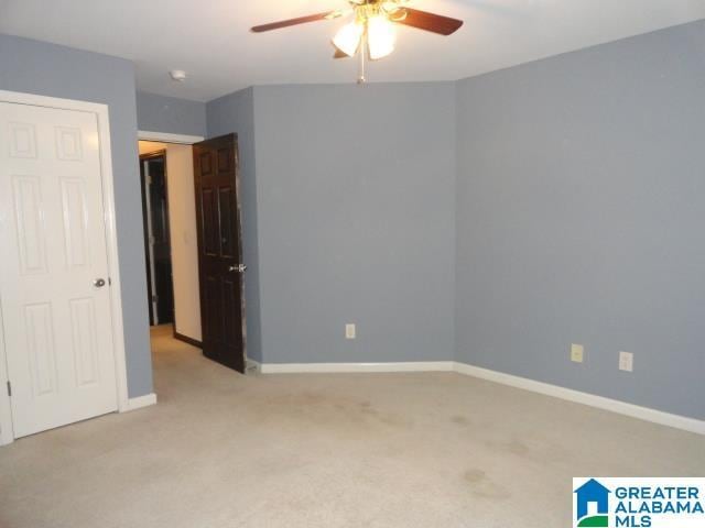 carpeted empty room with ceiling fan