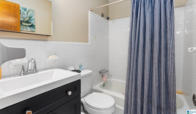 full bathroom with sink, shower / bath combination with curtain, tile walls, and toilet