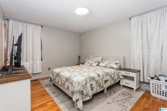 bedroom with hardwood / wood-style flooring