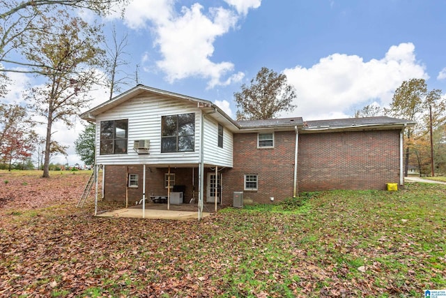 back of house with a patio and central AC unit