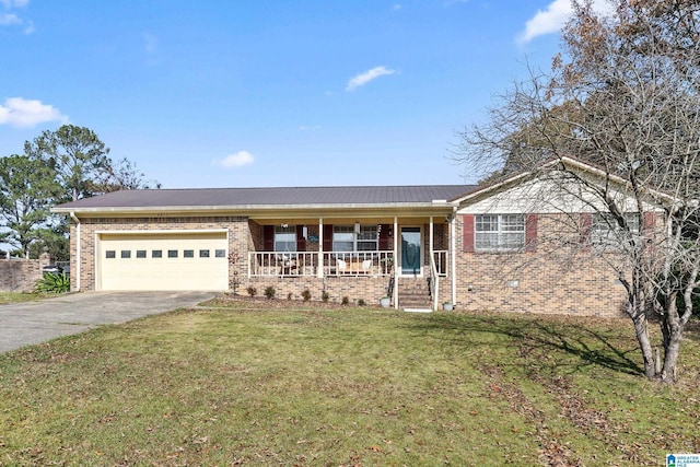 single story home featuring covered porch, a garage, and a front lawn