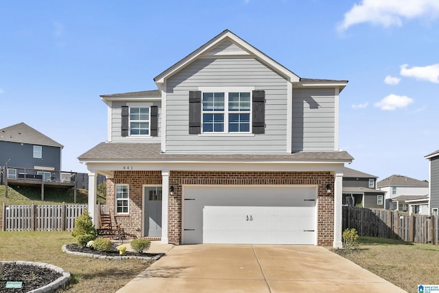 front facade with a front yard and a garage