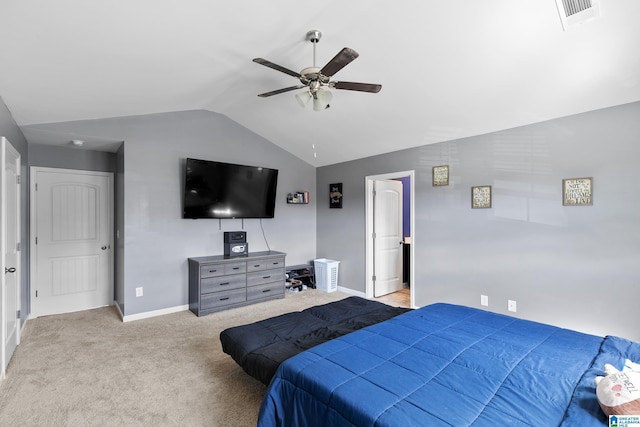 carpeted bedroom with ceiling fan and lofted ceiling