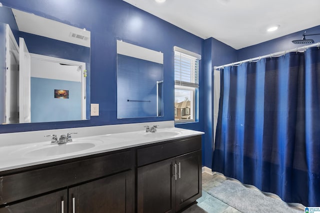 bathroom with vanity and curtained shower