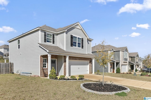 view of front of home featuring a front yard and a garage