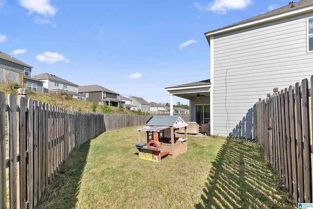 view of yard featuring ceiling fan