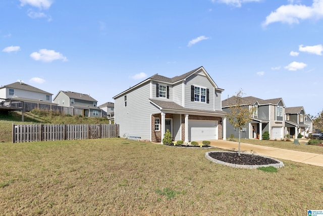 view of front of house with a garage and a front lawn