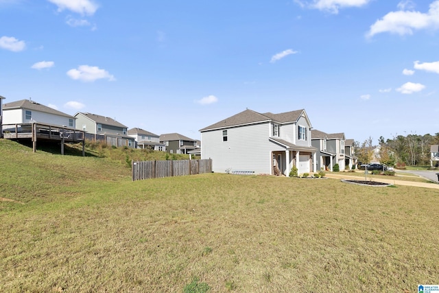 view of side of property with a lawn