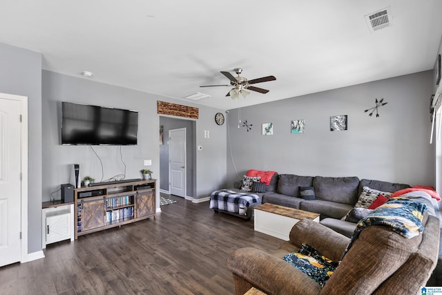 living room featuring ceiling fan and dark hardwood / wood-style floors