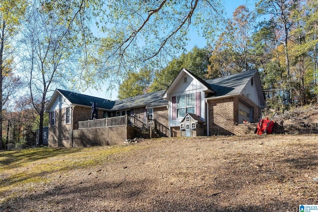 view of side of home with a garage and a yard