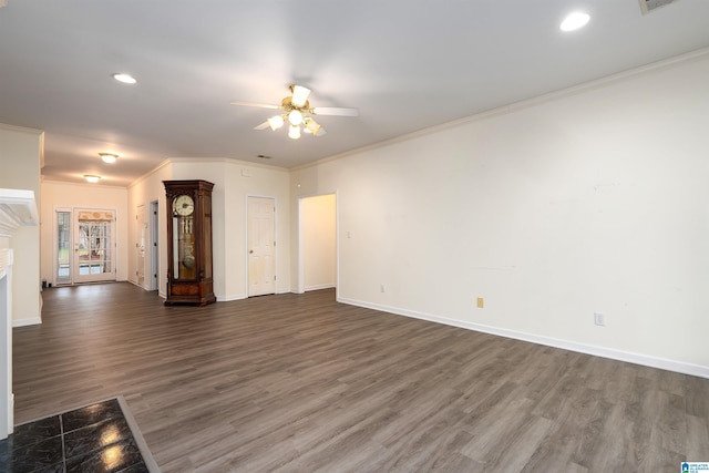 unfurnished living room featuring ceiling fan, dark hardwood / wood-style flooring, and ornamental molding