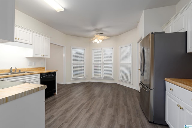 kitchen with wood counters, white cabinets, dark hardwood / wood-style floors, stainless steel fridge, and black dishwasher