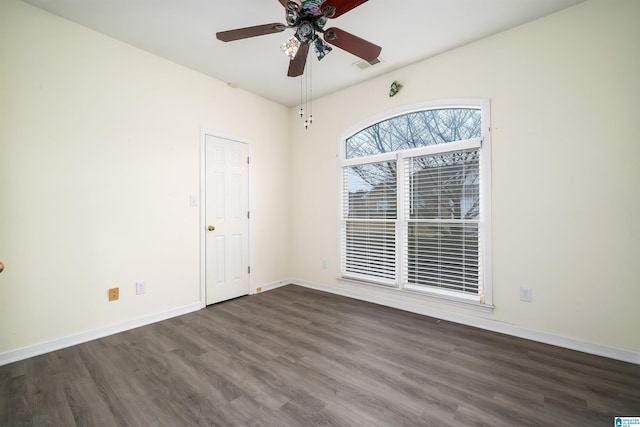 spare room featuring ceiling fan and dark hardwood / wood-style flooring