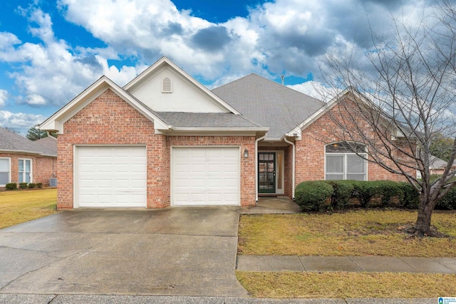 view of front of home featuring a garage and a front yard