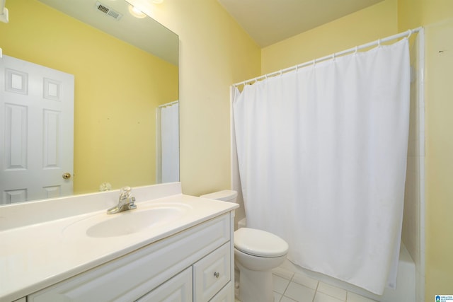 bathroom featuring toilet, vanity, and tile patterned floors