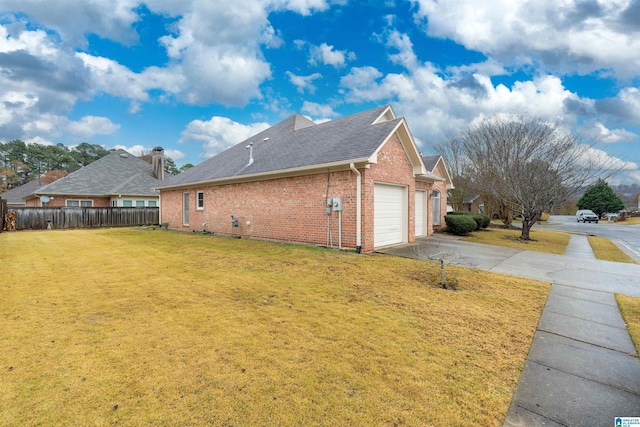 view of property exterior with a yard and a garage