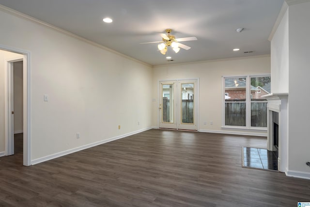 unfurnished living room featuring ceiling fan, dark hardwood / wood-style flooring, and ornamental molding