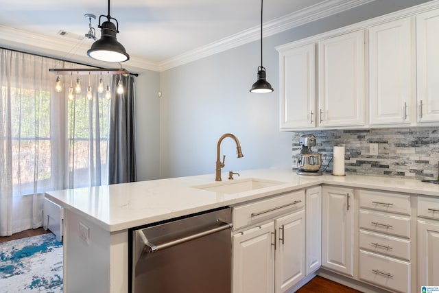 kitchen with hanging light fixtures, sink, white cabinets, and stainless steel dishwasher