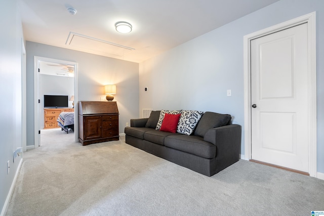 carpeted living room featuring ceiling fan