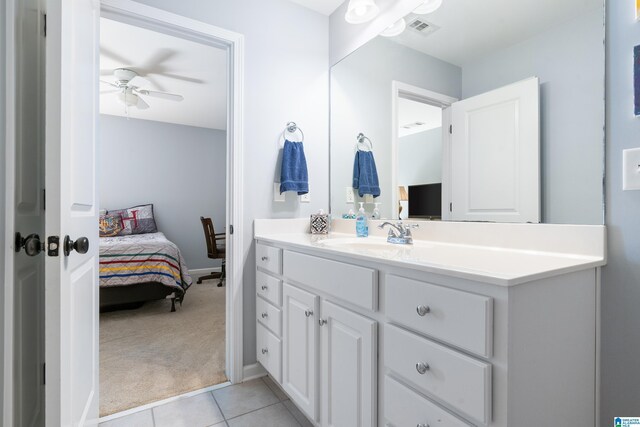 bathroom featuring tile patterned floors, ceiling fan, and vanity